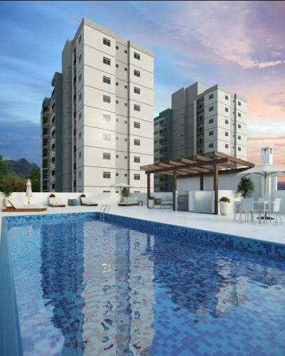 a swimming pool in front of two tall buildings at Apto TOP Camboriú próximo BC in Camboriú