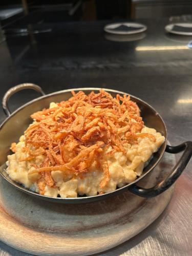 a metal pan filled with food on a table at Landgasthof Hirschen in Hohenems