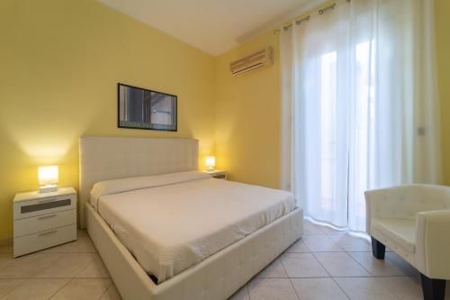 A bed or beds in a room at Apartments via Spano