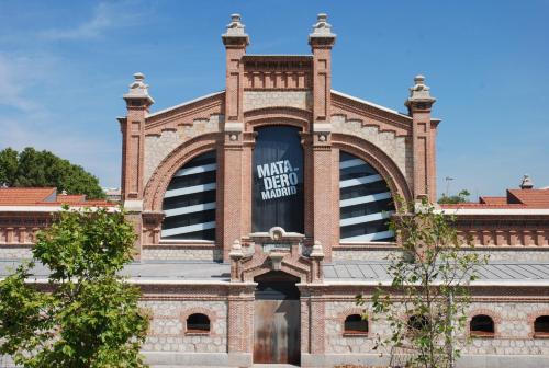 a building with a sign on the side of it at Antonio Lopez en Madrid in Madrid