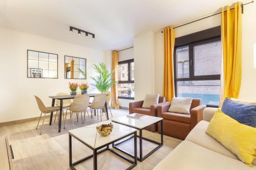 a living room with a couch and a table at Antonio Lopez en Madrid in Madrid