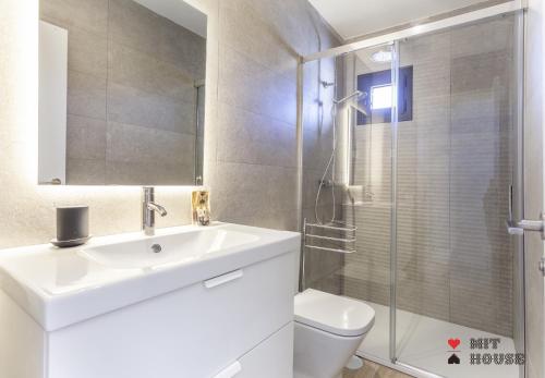 a bathroom with a sink and a toilet and a shower at Antonio Lopez en Madrid in Madrid