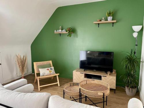 TV a/nebo společenská místnost v ubytování Appartement cosy proche gare