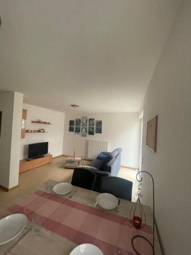 a living room with a couch and a table at Ferienwohnung im Herzen von Walldürn in Walldürn