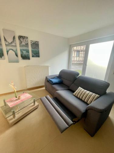 a living room with a couch and a table at Ferienwohnung im Herzen von Walldürn in Walldürn