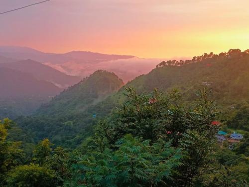 a view of a mountain valley at sunset at Nature Sanctuary Stay in Jutogh