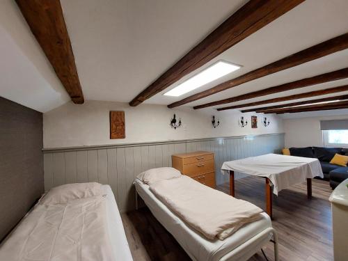a hospital room with two beds and a table at HAUS BRAILEN in Brilon Alme in Brilon