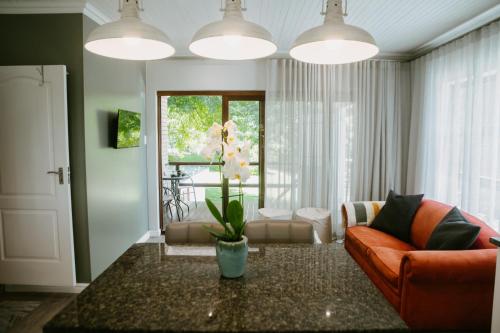a living room with a couch and a table at 62 on Adderley in George