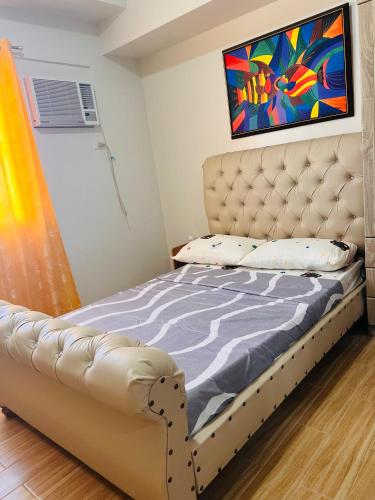 Ένα ή περισσότερα κρεβάτια σε δωμάτιο στο Tulip Garden Condominium Southwoods