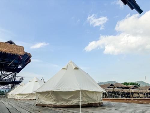 a group of tents sitting on top of a deck at Thailand Mountain Phuket in Patong Beach