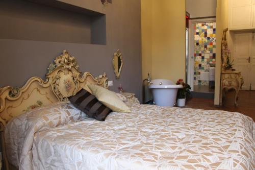 Katil atau katil-katil dalam bilik di B&B Suite Palazzo Luciani