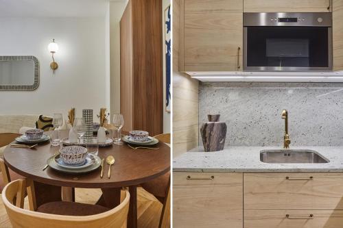 - une cuisine avec une table en bois et un évier dans l'établissement Sublime air-conditioned apartment Center of Paris, à Paris
