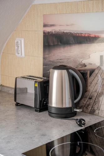 a toaster and toaster oven sitting on a counter at Sleep two Fly in Hamburg