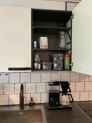 a kitchen with a sink and a counter top at Stylish home in Tikkakoski in Tikkakoski