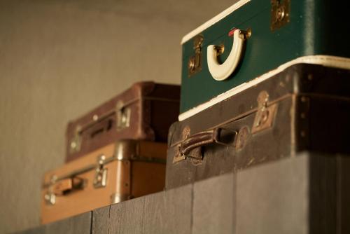 a pile of suitcases stacked on top of each other at Monastik Living in Athina in Athens