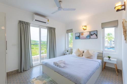 Postelja oz. postelje v sobi nastanitve Tranquil 1BHK suite Pool Field Calangute Da Alohas