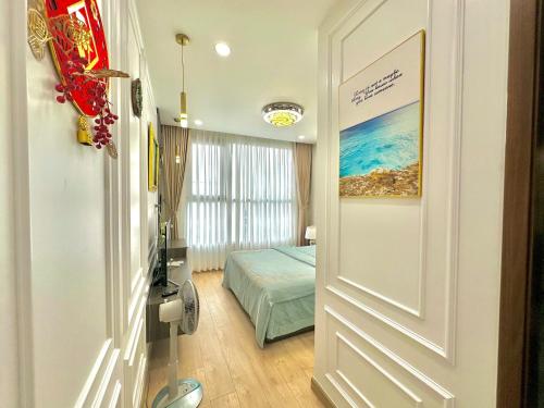 a door leading to a bedroom with a bed at Luxury Apartment with beautiful view in Hanoi