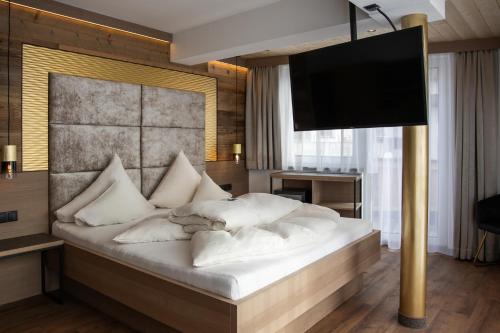 Hotel Das Köhle INKLUSIVE SUPER SOMMER CARD 2025にあるベッド