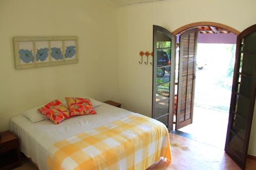 מיטה או מיטות בחדר ב-Pousada Sapucaia