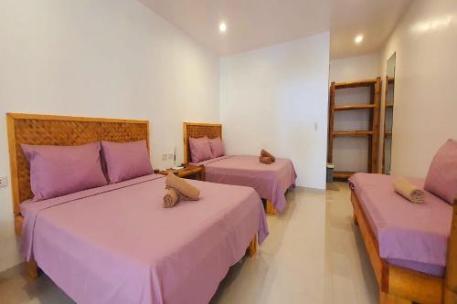 Postel nebo postele na pokoji v ubytování Pili Beach Resort Agmanic