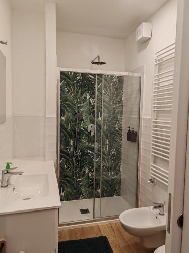 a bathroom with a shower and a sink at La Casa Del Quirino in Tirano