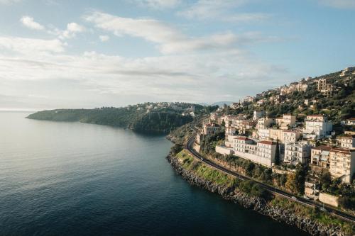 an aerial view of a city by the water at Infinity Hotel Gytheio in Gythio