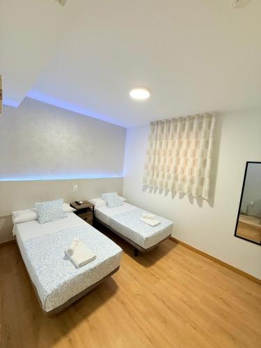 Katil atau katil-katil dalam bilik di Hostal Quinta Santillan