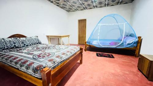 Postel nebo postele na pokoji v ubytování Sigiri Elephants Path Hostel