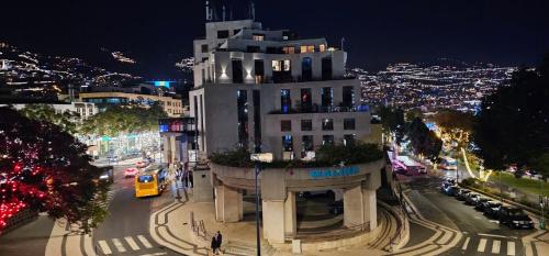 a building on a city street at night at Center Marina view Silver Studio in Funchal