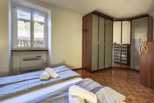a bedroom with a bed with two towels on it at Il Rustico in Castel San Pietro
