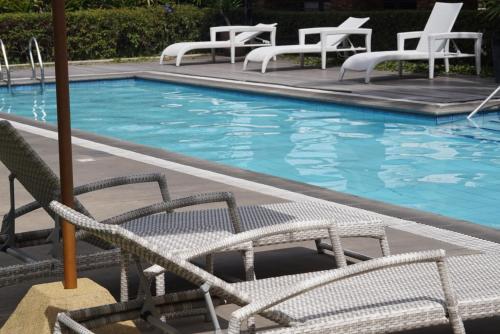 Πισίνα στο ή κοντά στο 8 Spatial 2BR Condo with Coffee Station