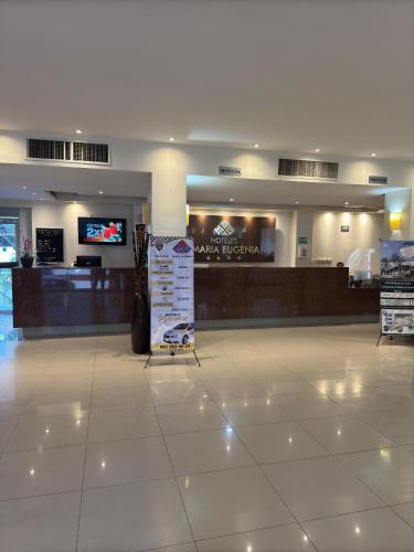 a shopping mall with a sign in the middle at Hotel María Eugenia Tuxtla Gutiérrez in Tuxtla Gutiérrez