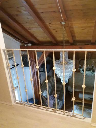 a chandelier hanging from a window in a room at Centralt i Gevgelija in Gevgelija