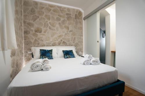 Postel nebo postele na pokoji v ubytování Lues Rooms