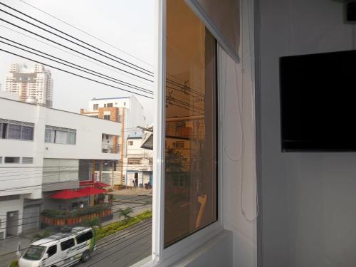 a window with a view of a city street at Casa Jac in Bucaramanga