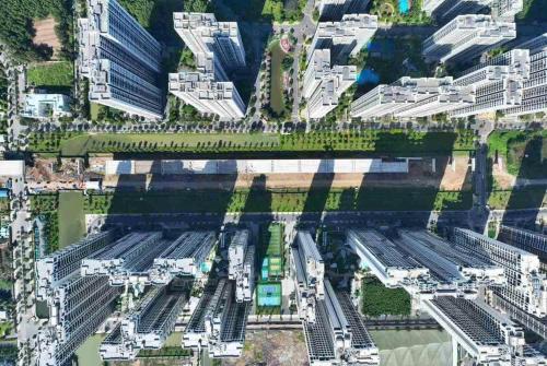 an overhead view of a city with a train yard at Suzon-Luxurious Apartment at Lumiere Boulevard VGP in Gò Công