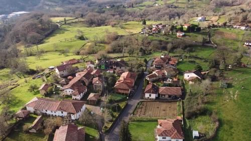 an aerial view of a small village with houses at El Balcon del Horreo in Piloña