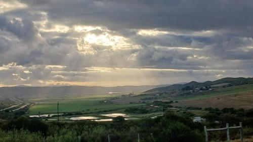 a view of a river under a cloudy sky at Yellow Door in Tergniet