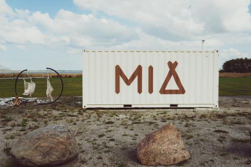 a large sign for a mx sign in a field at Mia Hotel in Orissaare