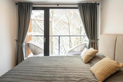 Ένα ή περισσότερα κρεβάτια σε δωμάτιο στο Leaf Loft Chalet