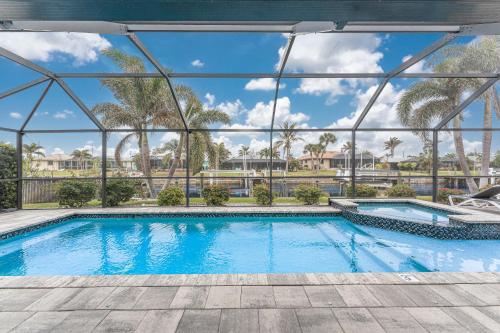 a swimming pool with a view of a resort at Villa Tranquility-Waterfront-Punta Gorda, FL in Punta Gorda