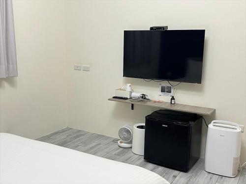 TV a/nebo společenská místnost v ubytování Kaile Roaming Homestay