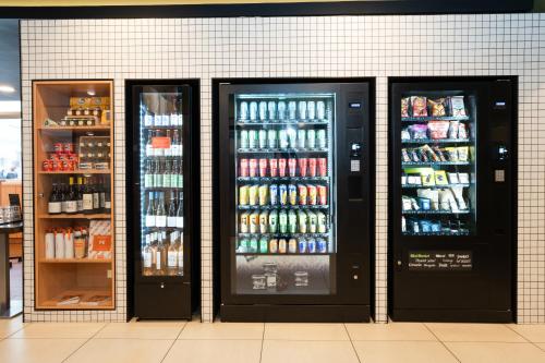 three large refrigerators in a store with drinks at easyHotel Nice Old Town in Nice
