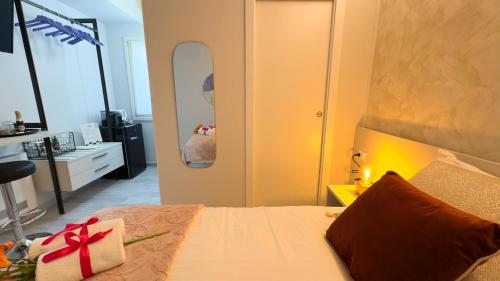 a bedroom with a bed with a gift on it at Do Campanili by Ca-Sa Check in Chioggia