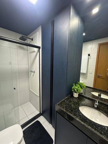 a bathroom with a shower and a sink and a toilet at Resort de Luxo em Muro Alto - Porto de Galinhas in Ipojuca
