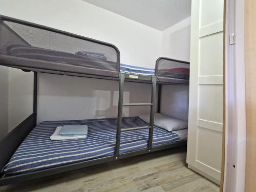 Postel nebo postele na pokoji v ubytování New Camping Coccorrocci