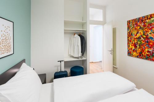 Кровать или кровати в номере BENSIMON apartments Mitte - Moabit