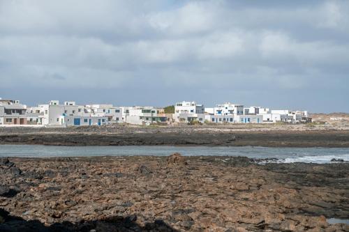 a group of white buildings on the beach at Casita Dangminzheng in Tao