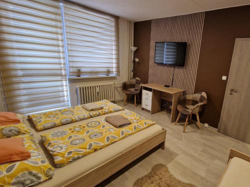 Postel nebo postele na pokoji v ubytování Apartman Valentina