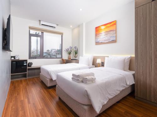 Ένα ή περισσότερα κρεβάτια σε δωμάτιο στο Dresidence Hotel Ninh Binh